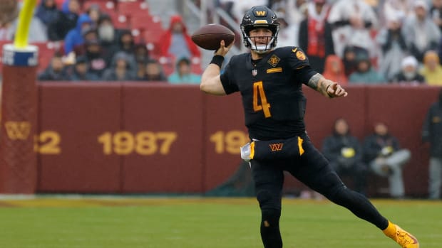 Commanders quarterback Taylor Heinicke throws the ball during a game.